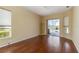 Sun-drenched bedroom featuring wood floors, a private entrance, and natural light at 1348 Reserve Dr, Venice, FL 34285