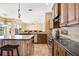 Elegant kitchen with stainless steel appliances and seamless transition to living area at 1348 Reserve Dr, Venice, FL 34285