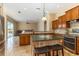 Kitchen with breakfast bar overlooking the living room and sliding doors to the pool at 1348 Reserve Dr, Venice, FL 34285
