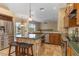 Spacious kitchen with granite countertops, stainless appliances, and a view of the pool at 1348 Reserve Dr, Venice, FL 34285