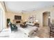Bright living room with a fireplace, neutral tones, and tile floors creates a warm, inviting space at 1348 Reserve Dr, Venice, FL 34285
