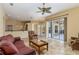 Bright living room with tile floors and sliders provides an inviting and spacious atmosphere at 1348 Reserve Dr, Venice, FL 34285