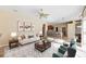 Open-concept living room with tile flooring offers an airy and connected living space at 1348 Reserve Dr, Venice, FL 34285