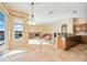 Open concept living space blends dining, living, and kitchen areas with pool views at 1348 Reserve Dr, Venice, FL 34285