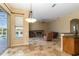 Spacious open living area with fireplace and access to the pool area at 1348 Reserve Dr, Venice, FL 34285