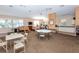 Spacious clubhouse featuring comfortable seating, exercise equipment, and kitchenette area at 201 Auburn Woods Cir, Venice, FL 34292