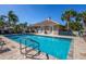 Relaxing community pool with a well-maintained deck and comfortable lounge chairs at 201 Auburn Woods Cir, Venice, FL 34292