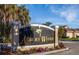 Elegant Auburn Woods community sign with lush landscaping in a serene setting at 201 Auburn Woods Cir, Venice, FL 34292