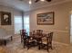 Dining room showcases shutters and a wood table at 201 Auburn Woods Cir, Venice, FL 34292