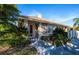Charming villa featuring a well-manicured lawn and a welcoming walkway to the front door at 201 Auburn Woods Cir, Venice, FL 34292