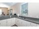 Practical kitchenette area with ample counter space, cabinets, and a sink at 201 Auburn Woods Cir, Venice, FL 34292
