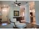 Spacious living room with wood flooring offering views of the dining area and a charming entry at 201 Auburn Woods Cir, Venice, FL 34292