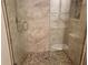 The walk-in shower features sleek glass doors and tiled walls, creating a spa-like experience at 201 Auburn Woods Cir, Venice, FL 34292