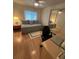 Cozy bedroom with daybed, desk and mirrored closet doors offering an abundance of storage space at 356 Longwood Dr, Venice, FL 34285