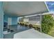 Spacious carport area offering covered parking and featuring a privacy screen at 356 Longwood Dr, Venice, FL 34285