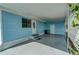 Covered carport area offering ample parking and storage, featuring light blue siding at 356 Longwood Dr, Venice, FL 34285