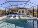 Screened-in pool and spa area, complete with lounge chairs for relaxing in the sun at 5733 Semolino St, Nokomis, FL 34275