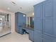 Bathroom vanity with granite counter, custom cabinets, and a large mirror above the sink at 2020 Harbourside Dr # 424, Longboat Key, FL 34228