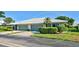 Charming single-story villa with a two-car garage, tidy landscaping and a bright white roof in a sunny neighborhood at 3117 Heron Shores Dr, Venice, FL 34293