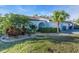 Charming single-story home with lush landscaping and mature palm trees in a well-maintained neighborhood at 507 Foxwood Blvd # 4, Englewood, FL 34223