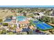 Aerial shot of community amenities including a pool, tennis courts and well landscaped grounds at 654 Bird Bay E Dr # 206, Venice, FL 34285