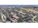 Community aerial view showcasing the mature trees, ponds, and proximity to urban amenities at 654 Bird Bay E Dr # 206, Venice, FL 34285