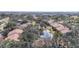Aerial view of the community featuring lush landscaping, ponds, and well-maintained buildings at 654 Bird Bay E Dr # 206, Venice, FL 34285