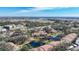 Overview of community with mature landscaping, pond, and convenient location close to amenities and highways at 654 Bird Bay E Dr # 206, Venice, FL 34285