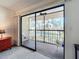 View from the room to the screened balcony that overlooks a scenic pond and landscape at 654 Bird Bay E Dr # 206, Venice, FL 34285