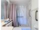 The accessible bathroom has a tiled walk-in shower, grab bars, and neutral decor at 654 Bird Bay E Dr # 206, Venice, FL 34285