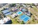 Aerial view of community amenities including tennis courts, pool, and recreational areas at 654 Bird Bay E Dr # 206, Venice, FL 34285
