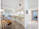 The dining room features bar seating and open concept views to the kitchen at 654 Bird Bay E Dr # 206, Venice, FL 34285