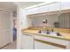 Kitchen with a sink, dishwasher, and a view into the living room at 654 Bird Bay E Dr # 206, Venice, FL 34285