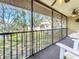 Relax on this screened lanai overlooking lush greenery and a serene pond at 654 Bird Bay E Dr # 206, Venice, FL 34285
