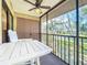 Enjoy the screened lanai with ceiling fan, table, and beautiful waterfront views at 654 Bird Bay E Dr # 206, Venice, FL 34285