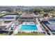 Aerial view of the community pool, highlighting the beautiful blue pool and surrounding community building at 654 Bird Bay E Dr # 206, Venice, FL 34285