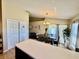 Bright dining room with a wooden table, modern chairs, and natural light at 8307 Glover Ave, North Port, FL 34291