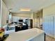 Bright kitchen boasts stainless steel appliances, white cabinetry, and a breakfast bar overlooking the adjacent living area at 8307 Glover Ave, North Port, FL 34291