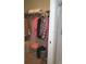 Well-organized closet with hanging clothes and shelving for storage solutions at 111 Woodbridge Dr # 204, Venice, FL 34293