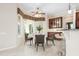 Eat-in kitchen features a cozy breakfast nook with bay windows and stylish furnishings at 1206 Tuscany Blvd, Venice, FL 34292