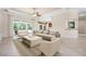 Comfortable living room with an open floorplan, tile flooring, and lots of light at 1206 Tuscany Blvd, Venice, FL 34292