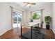 Office featuring access to a screened lanai and pool area with ceiling fan at 1206 Tuscany Blvd, Venice, FL 34292