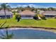 The backyard has a screen enclosed pool that overlooks the lake at 1815 Killdeer Ct, Venice, FL 34293