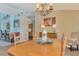 Cozy dining room with wood table, decor, and calming paint at 1815 Killdeer Ct, Venice, FL 34293