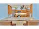 Modern kitchen featuring bar seating, stainless steel appliances, and ample cabinet space at 1815 Killdeer Ct, Venice, FL 34293