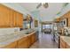 Open kitchen layout with modern appliances and tile flooring at 1815 Killdeer Ct, Venice, FL 34293