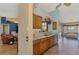 Spacious kitchen featuring light countertops and view of pool area at 1815 Killdeer Ct, Venice, FL 34293