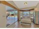 Bright seating area with views of the pool at 1815 Killdeer Ct, Venice, FL 34293