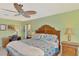Bedroom with floral bedding and matching décor at 1815 Killdeer Ct, Venice, FL 34293
