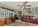 Cozy office with a comfortable couch, desk and a light green wall at 1815 Killdeer Ct, Venice, FL 34293